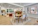 Elegant dining room with ample natural light, and an open layout to living at 1343 Milwaukee St, Denver, CO 80206