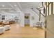Bright foyer with staircase, light hardwood floors and open floor plan at 1343 Milwaukee St, Denver, CO 80206