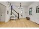 Inviting entryway with hardwood floors, staircase and natural light at 1343 Milwaukee St, Denver, CO 80206