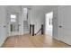 Hallway with hardwood floors and a staircase leading to the next level at 1343 Milwaukee St, Denver, CO 80206