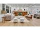 Cozy living room featuring a fireplace, built-in shelves, and hardwood floors at 1343 Milwaukee St, Denver, CO 80206