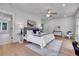 Spacious bedroom features hardwood floors, a ceiling fan, and a walk-in closet at 1343 Milwaukee St, Denver, CO 80206
