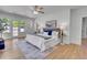Bright main bedroom with french doors, ceiling fan, and serene decor at 1343 Milwaukee St, Denver, CO 80206