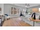 Bright main bedroom features hardwood floors, a ceiling fan, and multiple windows for ample natural light at 1343 Milwaukee St, Denver, CO 80206