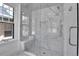 Stunning marble shower with a glass door and a built-in bench at 1343 Milwaukee St, Denver, CO 80206