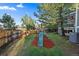 Backyard with playground and woodchip play area at 7291 Palisade Dr, Highlands Ranch, CO 80130