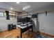 Finished basement office space with built-in shelving and hardwood floors at 7291 Palisade Dr, Highlands Ranch, CO 80130