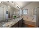 Large bathroom with granite countertop double vanity and bathtub at 7291 Palisade Dr, Highlands Ranch, CO 80130