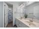 Clean bathroom with double vanity and a shower at 7291 Palisade Dr, Highlands Ranch, CO 80130
