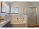 Bathroom with granite countertop vanity and a shower at 7291 Palisade Dr, Highlands Ranch, CO 80130