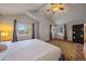Spacious primary bedroom with vaulted ceiling and large windows at 7291 Palisade Dr, Highlands Ranch, CO 80130