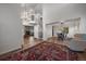 Open concept entryway with hardwood floors, a staircase, and views to the dining area at 7291 Palisade Dr, Highlands Ranch, CO 80130