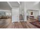 Bright and spacious entryway with hardwood floors, staircase, and views to living areas at 7291 Palisade Dr, Highlands Ranch, CO 80130