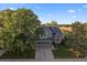 Two-story house with gray siding, brick accents, and a two-car garage at 7291 Palisade Dr, Highlands Ranch, CO 80130