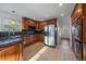 Kitchen with granite countertops, wood cabinets, and stainless steel appliances at 7291 Palisade Dr, Highlands Ranch, CO 80130