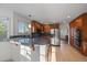 Kitchen with stainless steel appliances and an island breakfast bar at 7291 Palisade Dr, Highlands Ranch, CO 80130