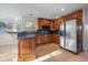 Bright kitchen, granite countertops, wood cabinets, and stainless steel appliances at 7291 Palisade Dr, Highlands Ranch, CO 80130