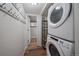 Convenient laundry room with washer, dryer, and storage at 7291 Palisade Dr, Highlands Ranch, CO 80130
