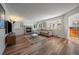 Living room featuring hardwood floors and a cozy fireplace at 7291 Palisade Dr, Highlands Ranch, CO 80130