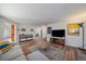 Spacious living room with hardwood floors and a fireplace at 7291 Palisade Dr, Highlands Ranch, CO 80130