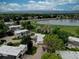 An aerial perspective showcasing homes close to a scenic lake at 1769 S Lee St # B, Lakewood, CO 80232