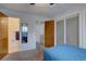 Comfortable bedroom with doorway to en-suite bathroom and closet with sliding doors at 1769 S Lee St # B, Lakewood, CO 80232