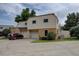Inviting two-story home with attached garage and mature trees in front yard at 1769 S Lee St # B, Lakewood, CO 80232