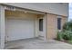 Attached one car garage with white door next to front entryway at 1769 S Lee St # B, Lakewood, CO 80232