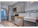 Updated kitchen featuring stainless steel appliances, wood counters, and subway backsplash at 1769 S Lee St # B, Lakewood, CO 80232