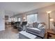 Bright living room features neutral decor, recessed lights, and wood flooring at 1769 S Lee St # B, Lakewood, CO 80232