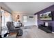 Comfortable living room with wood flooring, soft sofa, and television at 1769 S Lee St # B, Lakewood, CO 80232