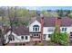 Aerial view of the home showcasing its brick exterior, dormer windows, and landscaping at 7682 S Steele St, Centennial, CO 80122
