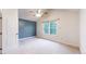 Spacious bedroom with vaulted ceilings and a large window overlooking the trees at 7682 S Steele St, Centennial, CO 80122