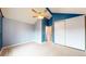 Bedroom featuring blue and gray walls, a ceiling fan, and ample closet space at 7682 S Steele St, Centennial, CO 80122