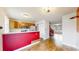 Eat-in kitchen with stainless steel refrigerator and view to living room at 7682 S Steele St, Centennial, CO 80122
