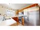 Bright kitchen with stainless steel appliances, window over sink, and wood cabinets at 7682 S Steele St, Centennial, CO 80122