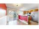 Eat-in kitchen with stainless steel refrigerator and access to outdoor patio at 7682 S Steele St, Centennial, CO 80122