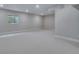 Bright basement living area with a window view at 8585 Eckley St, Littleton, CO 80125