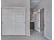 Bright bedroom featuring a closet, gray walls and carpet, and ensuite bathroom at 8585 Eckley St, Littleton, CO 80125