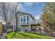 A home with a bay window has a deck and a brick patio and a grassy back yard at 9125 W 95Th Ave, Westminster, CO 80021