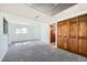 Spacious basement with neutral carpet and built-in wooden storage at 9125 W 95Th Ave, Westminster, CO 80021