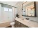 Well-lit bathroom features a modern vanity with a marble countertop and tub at 9125 W 95Th Ave, Westminster, CO 80021