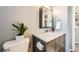 Stylish bathroom with modern vanity, marble countertop, and sleek fixtures at 9125 W 95Th Ave, Westminster, CO 80021