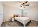 Cozy bedroom features a ceiling fan, plush carpet, and abundant natural light at 9125 W 95Th Ave, Westminster, CO 80021