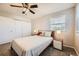 Comfortable bedroom with a ceiling fan, soft carpet, and a spacious closet at 9125 W 95Th Ave, Westminster, CO 80021