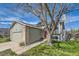 Charming home with a well-manicured lawn, brick accents, and a red front door at 9125 W 95Th Ave, Westminster, CO 80021
