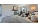 Cozy living room featuring a fireplace, plush seating, and soft natural light at 9125 W 95Th Ave, Westminster, CO 80021