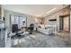 Bright living room with fireplace, neutral colors, large window, and stylish furniture at 9125 W 95Th Ave, Westminster, CO 80021