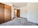 Bright and empty carpeted room featuring wood trim closet at 9125 W 95Th Ave, Westminster, CO 80021
