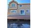 Back exterior of home showing deck, sliding glass door, and neutral colored siding at 1148 S Duquesne Cir, Aurora, CO 80018
